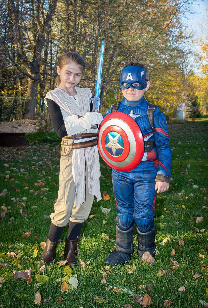 Girl and boy dress in Halloween costumes