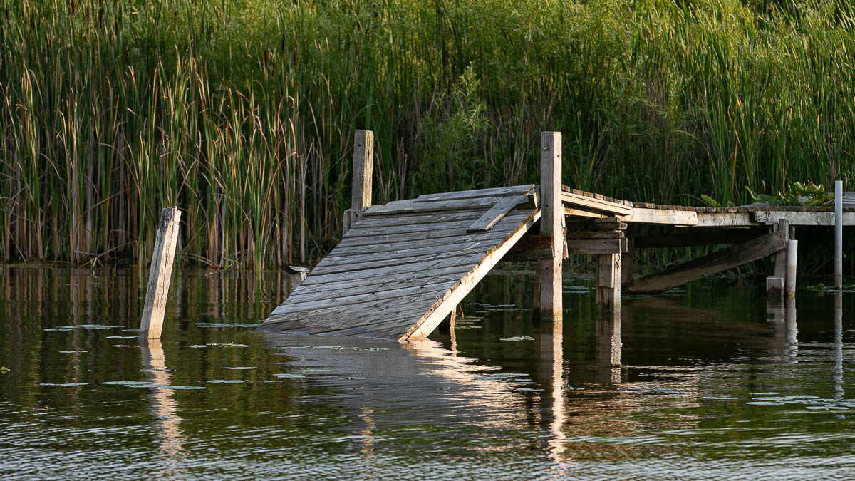 Broken dock above water